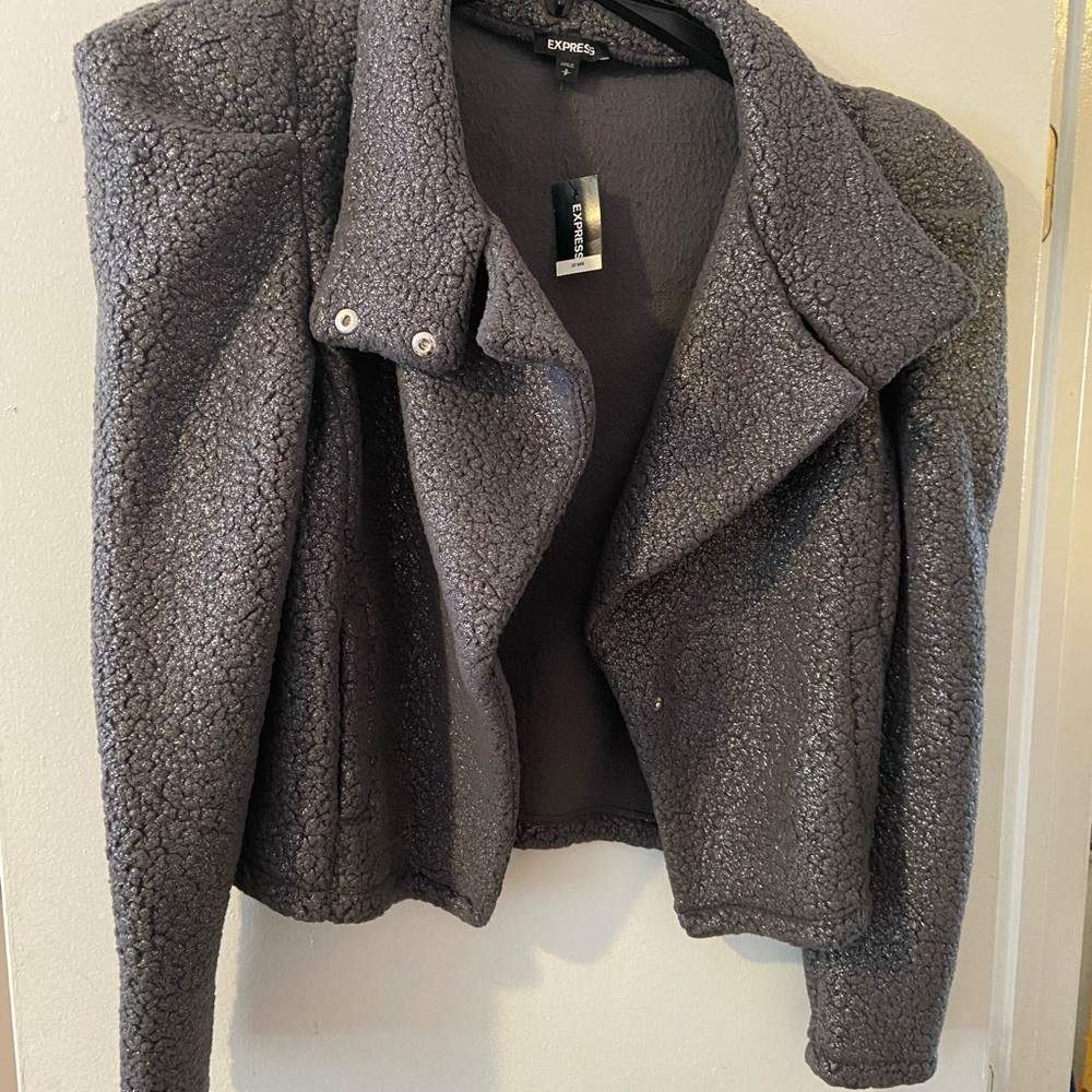 Express Grey in Color shimmer Jacket it runs big I’m a medium I can fit small